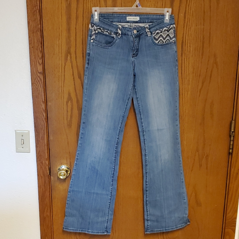 Light Wash Flare Jeans with Embroidered Trim